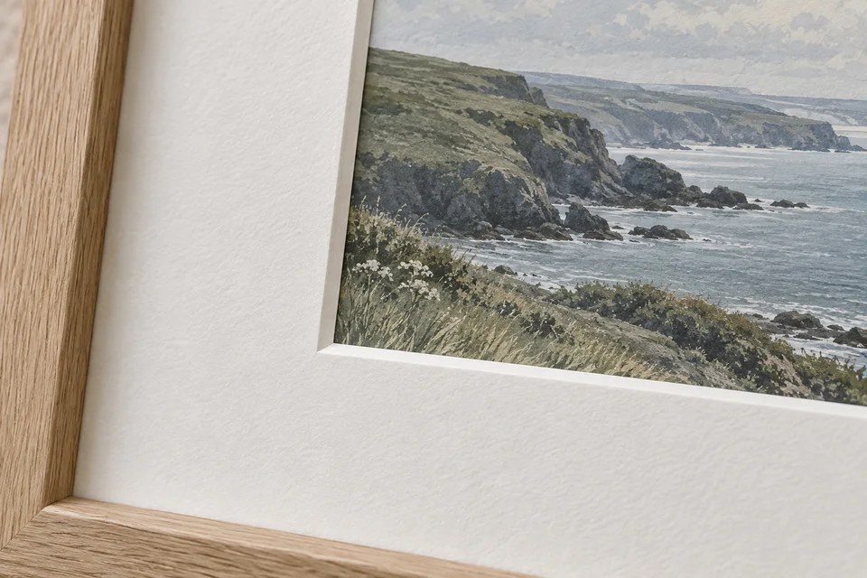 Close view of a bevelled white card mount surrounding an art print.