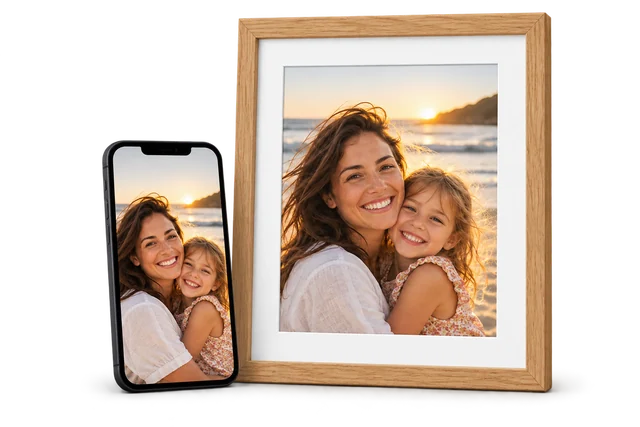 The same family photo on a phone and printed in an oak frame